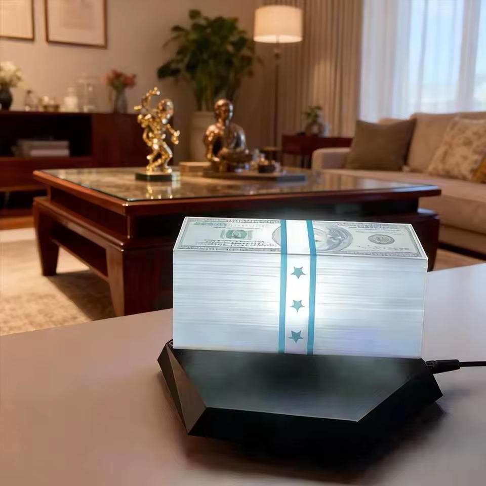 Floating Money Lamp glowing teal in a living room