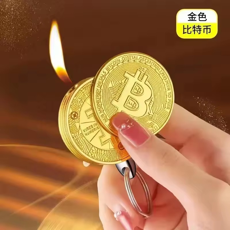 Gold coin-shaped lighter keychain shown lit in a hand