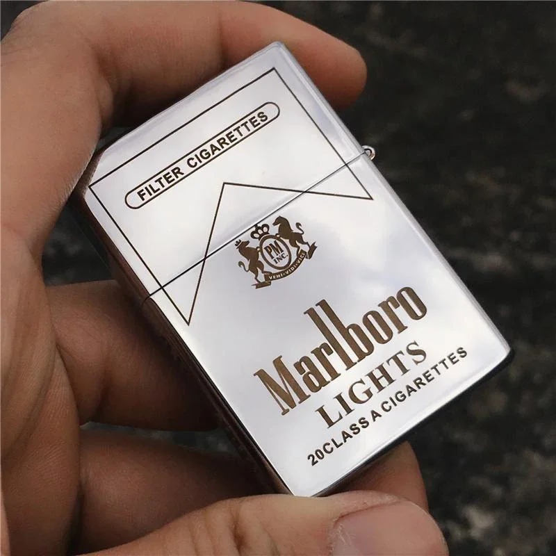 White metal flip lighter held in a hand