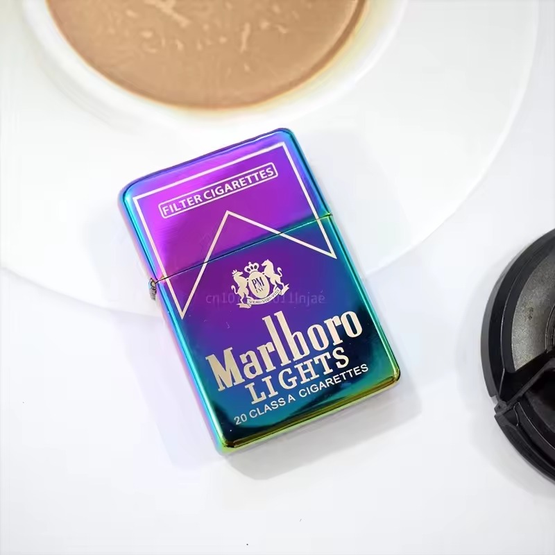 Iridescent metal flip lighter on a white tabletop