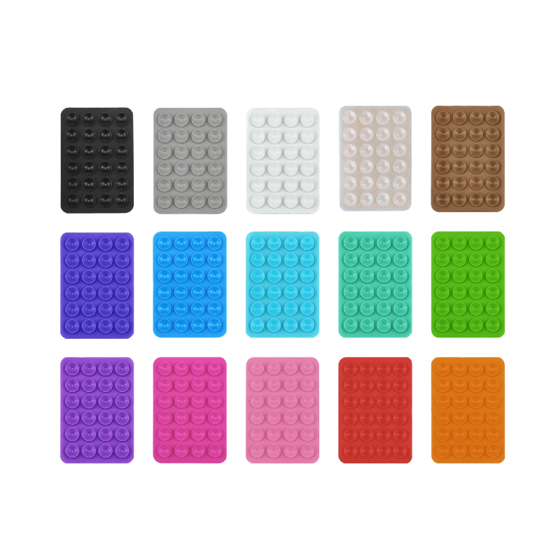 Silicone sticky phone grip shown on a phone and as loose grips